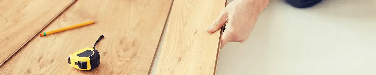 A professional installing wood flooring in Reno, NV
