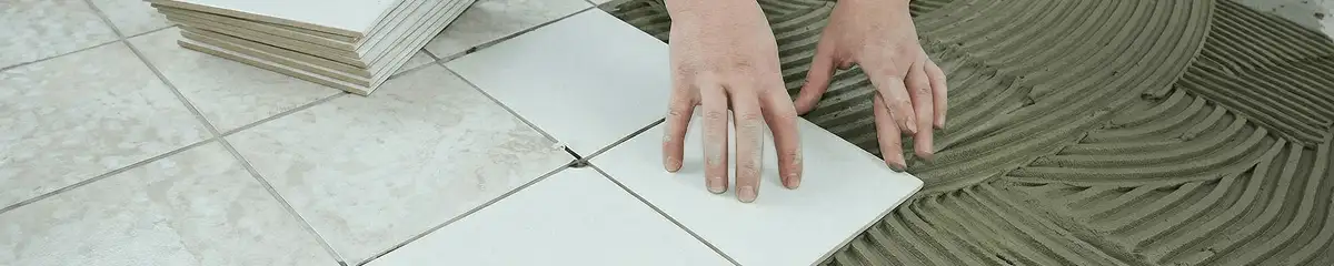 Professional installing white tile floors in Reno, NV