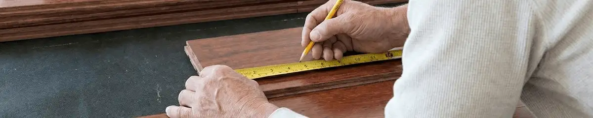 A professional installing wood flooring in Reno, NV
